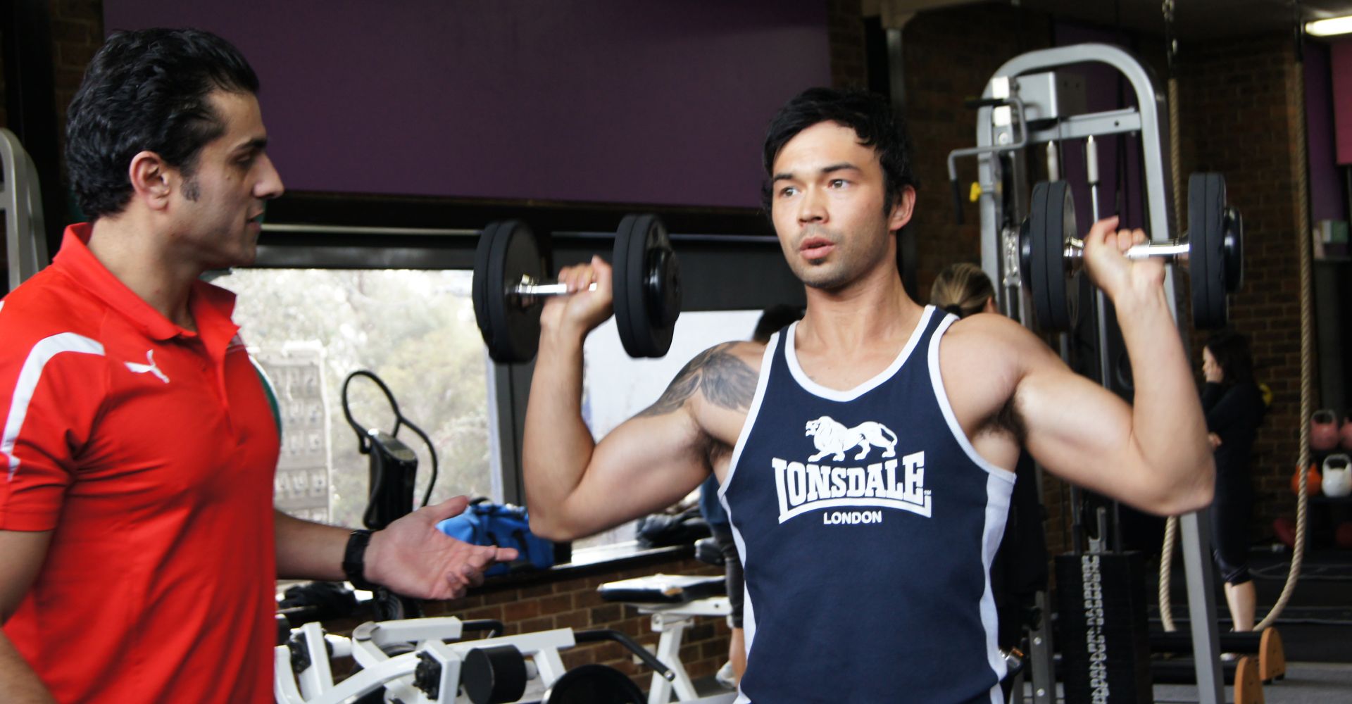 Personal Trainer Kaywan with a client working on achieving his strength and fitness goals